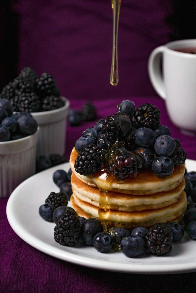 Here are some blueberries with pancakes. can dogs eat blueberries?